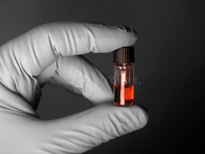 Important sample shown by hand protected with gloove. Hand and background desaturated, sample with original color (see my portofolio for other photos related to chemistry design). Important sample shown by hand protected with gloove. Hand and background desaturated, sample with original color (see my portofolio for other photos related to chemistry design)