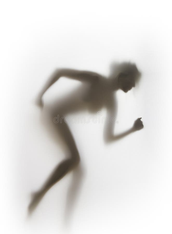 La silhouette sportive sexy de corps de femme de coureur, préparent pour commencer images stock La silhouette sportive sexy de corps de femme de coureur, préparent pour commencer images stock