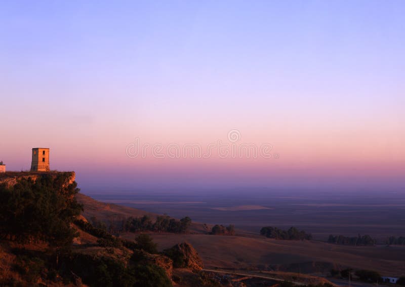 A photo of a castle high up overlooking the Andalucia plains of Southern Spain. A photo of a castle high up overlooking the Andalucia plains of Southern Spain.