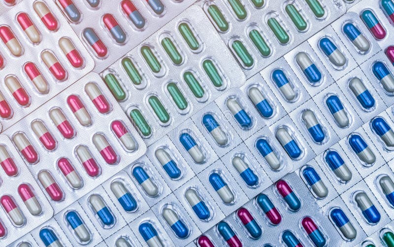La struttura completa delle pillole variopinte della capsula in blister ha sistemato con il bello modello Imballaggio farmaceutic immagine stock libera da diritti La struttura completa delle pillole variopinte della capsula in blister ha sistemato con il bello modello Imballaggio farmaceutic immagine stock libera da diritti