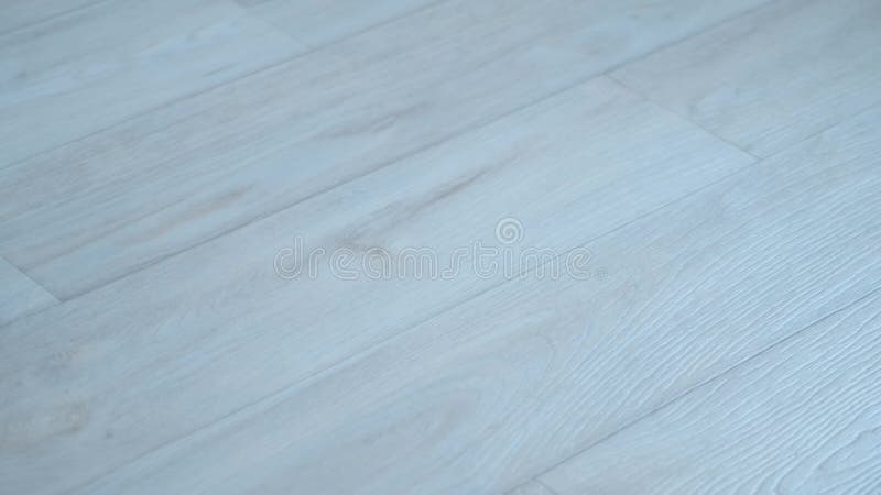 La struttura della superficie di linoleum grigio sul pavimento con disegno in legno.