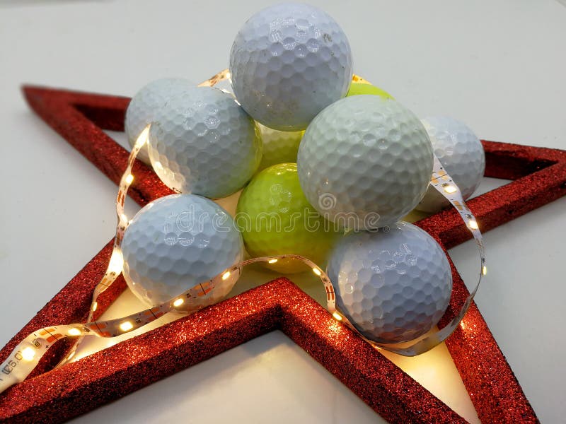 Christmas card inspired by golf balls framed by a red star. Christmas card inspired by golf balls framed by a red star