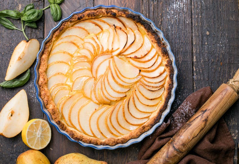 La Tarte Bourdaloue - French pear tart or pie with fresh pear fruits. La Tarte Bourdaloue - French pear tart or pie with fresh pear fruits