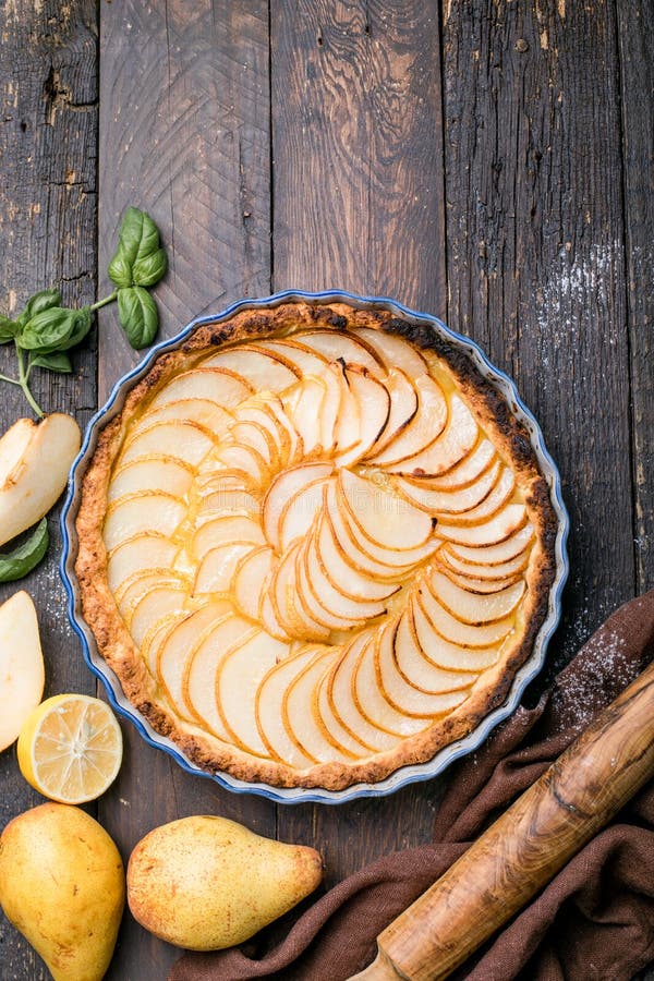 La Tarte Bourdaloue - French pear tart or pie with fresh pear fruits. La Tarte Bourdaloue - French pear tart or pie with fresh pear fruits