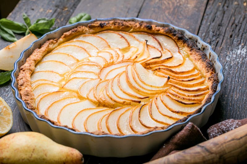 La Tarte Bourdaloue - French pear tart or pie with fresh pear fruits. La Tarte Bourdaloue - French pear tart or pie with fresh pear fruits