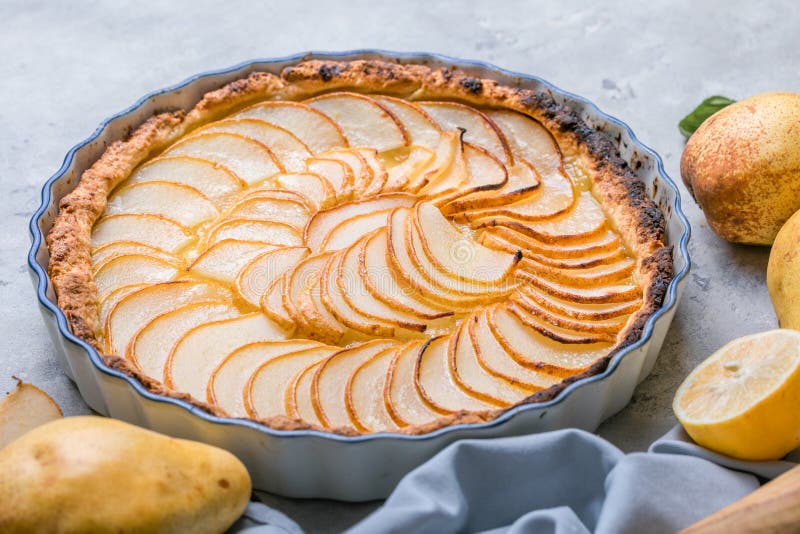 La Tarte Bourdaloue - French pear tart or pie with fresh pear fruits. La Tarte Bourdaloue - French pear tart or pie with fresh pear fruits