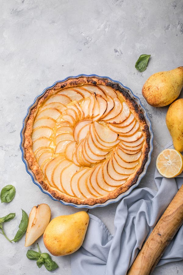 La Tarte Bourdaloue - French pear tart or pie with fresh pear fruits. La Tarte Bourdaloue - French pear tart or pie with fresh pear fruits