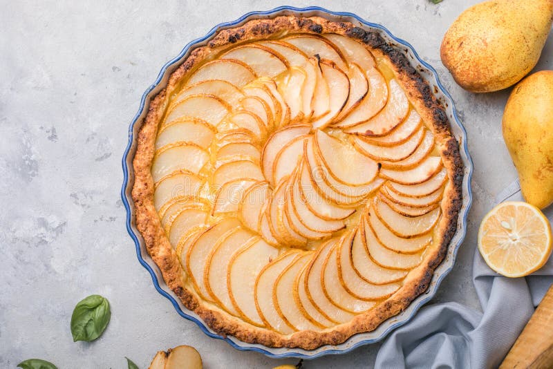 La Tarte Bourdaloue - French pear tart or pie with fresh pear fruits. La Tarte Bourdaloue - French pear tart or pie with fresh pear fruits