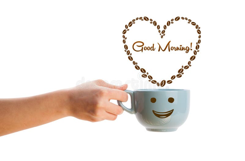 La tazza da caffè con i chicchi di caffè ha modellato il cuore con il segno di buongiorno fotografia stock La tazza da caffè con i chicchi di caffè ha modellato il cuore con il segno di buongiorno fotografia stock