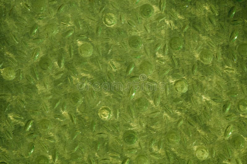 La textura de la superficie de cristal acanalada verde fotos de archivo La textura de la superficie de cristal acanalada verde fotos de archivo