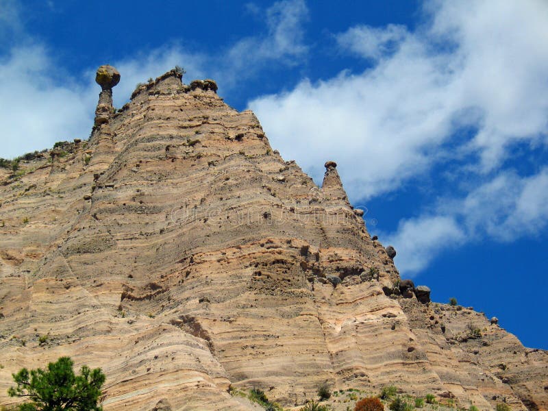 Kashe-Katuwe Tent Rocks National Monument located approximately 40 miles southwest of Santa Fe, New Mexico, near Cochiti Pueblo. Kasha-Katuwe means `white cliffs` in the Pueblo language Keresan. Kashe-Katuwe Tent Rocks National Monument located approximately 40 miles southwest of Santa Fe, New Mexico, near Cochiti Pueblo. Kasha-Katuwe means `white cliffs` in the Pueblo language Keresan.