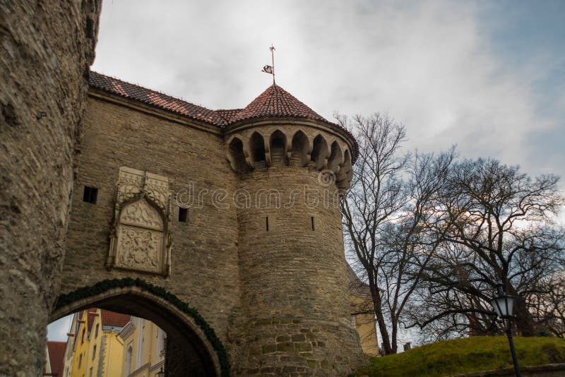 The Fat Margaret cannon tower. Landscape with clouds in cloudy weather, close-up of the tower. Entrance gate to the fortress. Tallinn, Estonia. The Fat Margaret cannon tower. Landscape with clouds in cloudy weather, close-up of the tower. Entrance gate to the fortress. Tallinn, Estonia