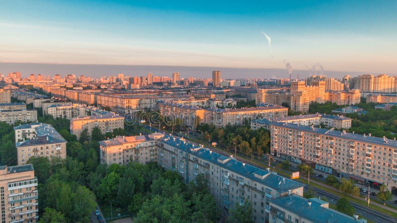 Moscow city bathed in yellow sun at dawn timelapse. Life in the stone jungle. An early foggy morning. Shadows moving on houses. Megalopolis aerial view from rooftop at Leninskiy avenue. The sky is burning. Moscow city bathed in yellow sun at dawn timelapse. Life in the stone jungle. An early foggy morning. Shadows moving on houses. Megalopolis aerial view from rooftop at Leninskiy avenue. The sky is burning