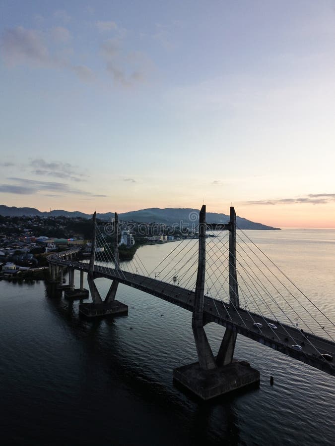 Aerial View of Iconic Merah Putih Cable Stayed Bridge accross Ambon Bay and Wai Ruhu Galala Yellow Truss Bridge. Aerial View of Iconic Merah Putih Cable Stayed Bridge accross Ambon Bay and Wai Ruhu Galala Yellow Truss Bridge.