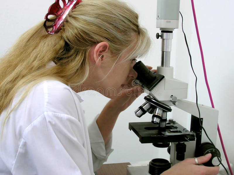 Lab 3. Scientist looking thru a microscope Lab 3. Scientist looking thru a microscope