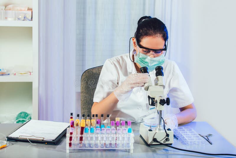 Lab Technician Assistant Analyzing a Blood Sample at Laboratory. Stock