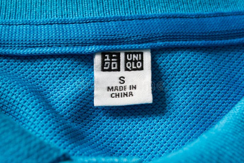 Label tag on Uniqlo shirt editorial photography. Image of blue - 90170177