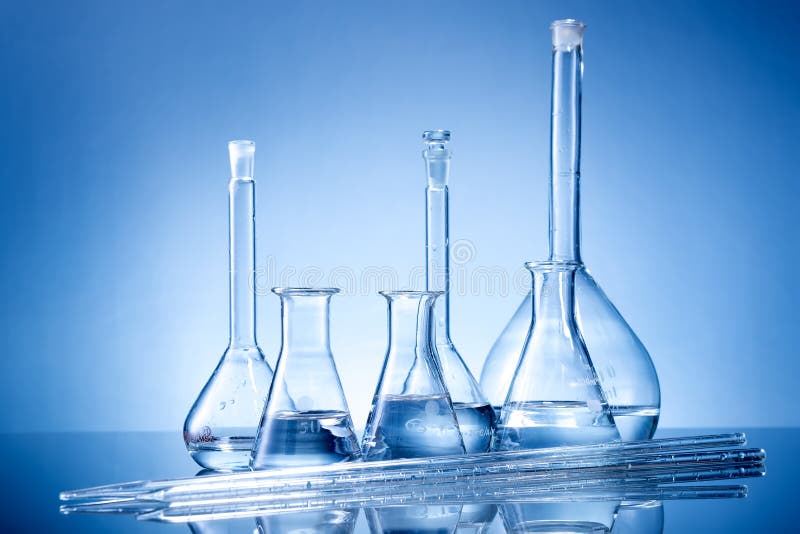 Laboratory equipment, glass flasks, pipettes on blue background . Laboratory equipment, glass flasks, pipettes on blue background .