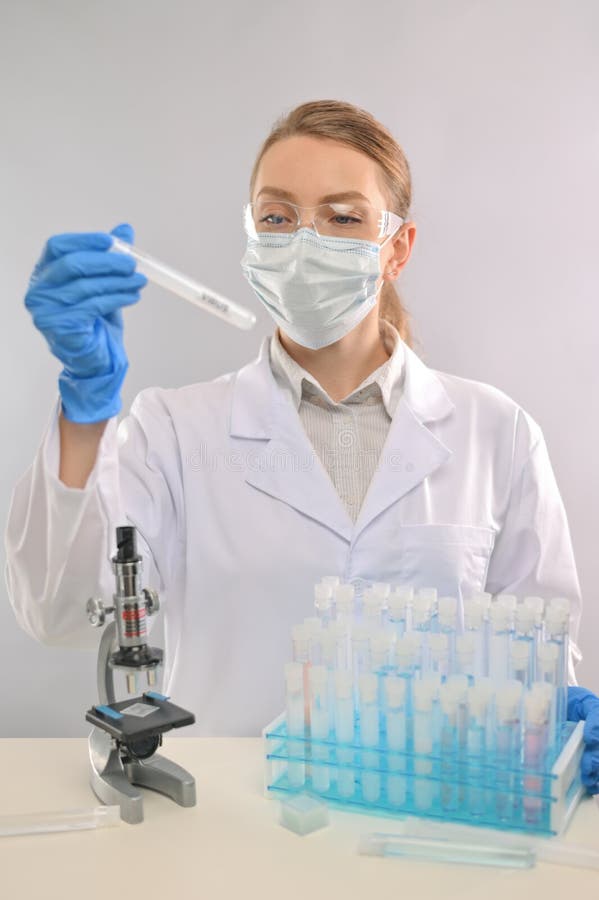 Laboratory process of work on a vaccine against coronavirus, Virologist. Vertical photo, laboratory stock photo