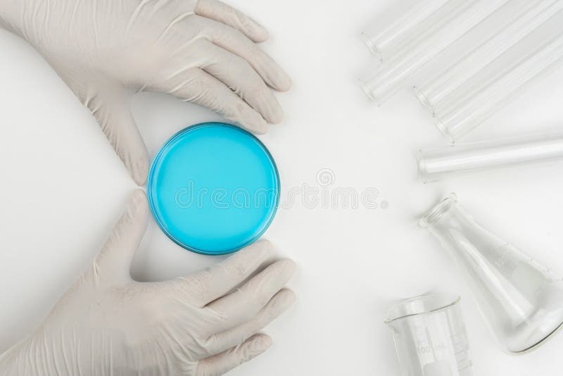 laboratory scene, the scientist holding the glass stirring rod