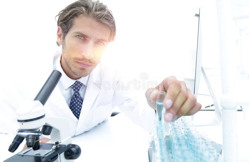 Laboratory Scientist Working In A Laboratory With A Microscope Stock