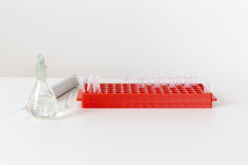 Laboratory Table with Flask, Digital Pipette and Small Plastic Test Tubes. Stock Image Image