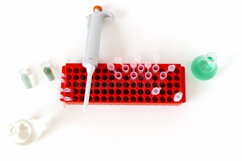 Laboratory Table with Flask, Digital Pipette and Small Plastic Test Tubes. Stock Photo Image