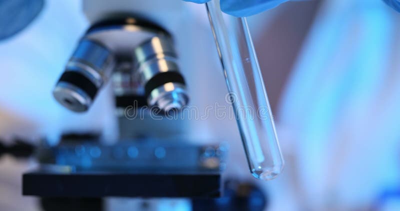 Laboratory technician collects smear in glass tube stock video