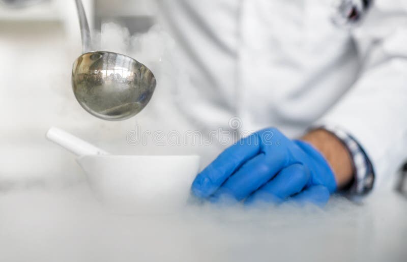 Laboratory technician performs an experiment with liquid nitrogen