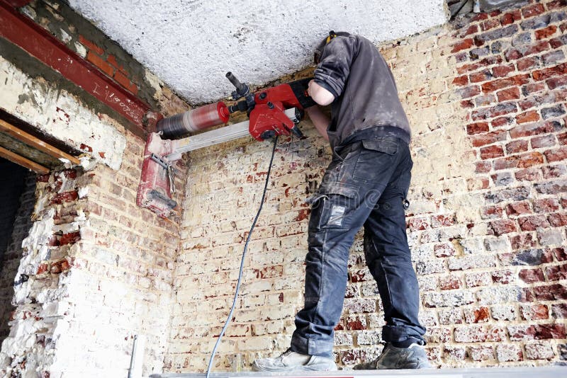 Laborer Pierce a Big Round Hole in a Brick Wall Stock Image Image of