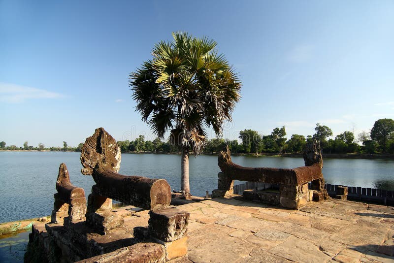 Ruined ancient sandstone structures and statues at Srah Srang Lake at UNESCO's World Heritage Site of Angkor, Siem Reap, Cambodia. Ruined ancient sandstone structures and statues at Srah Srang Lake at UNESCO's World Heritage Site of Angkor, Siem Reap, Cambodia