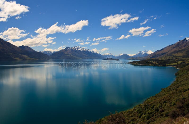 Scenic view of Lake Wakatipu with Southern Alps in background near Queenstown, South Island, New Zealand. Scenic view of Lake Wakatipu with Southern Alps in background near Queenstown, South Island, New Zealand
