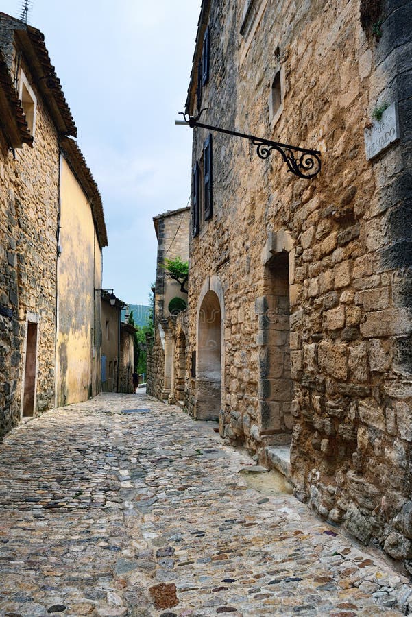 Medieval street in beautiful village of Lacoste after an evening rain. Lacoste is best known for its most notorious resident, Donatien Alphonse Francois comte de Sade, the Marquis de Sade