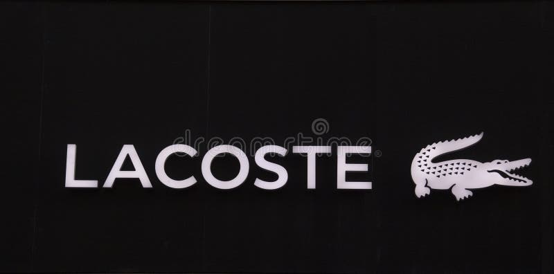 Lacoste Letters and Crocodile on a Wall Editorial - Image of boutique, 84866685