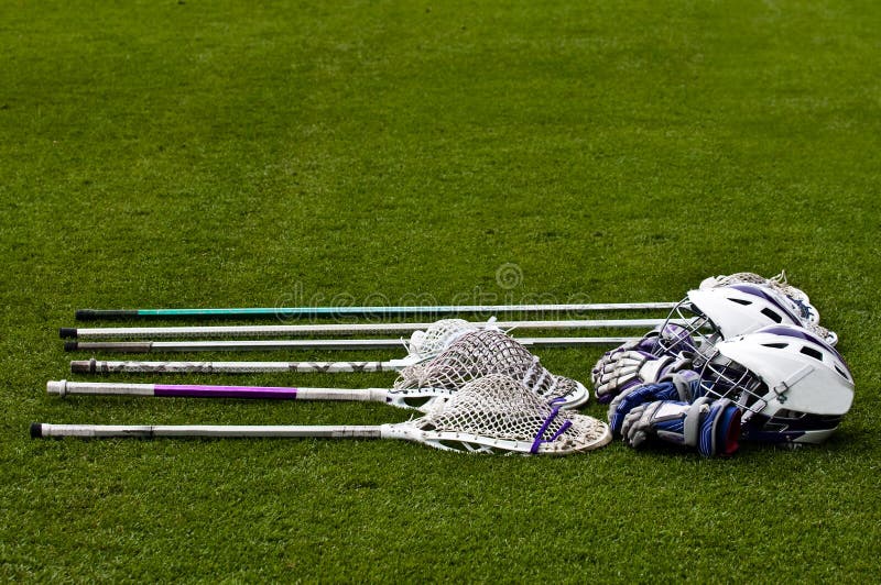 Four High School Boys Lacrosse Sticks Laying Green Turf Field Stock Photo  by ©WoodysPhotos 209888746