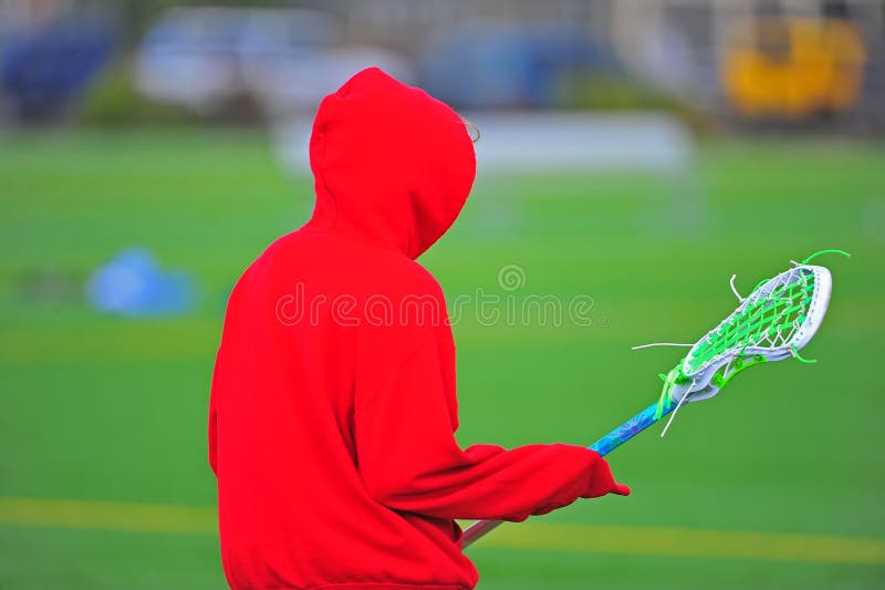 Lacrosse Player in a Red Hoodie Stock Photo Image of uniform, safety