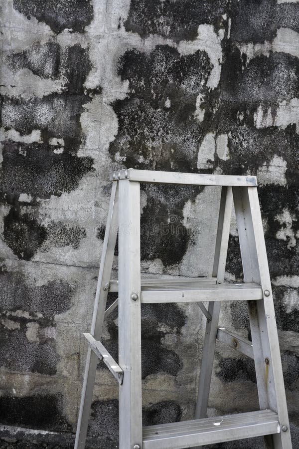 Ladder beside the wall stock photo. Image of wall, concrete 17640136