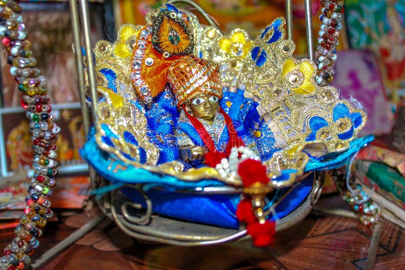 Premium Photo  Bal krishna laddu gopal brass statue with beautiful yellow  cloths and jewelry krishna janmashtami
