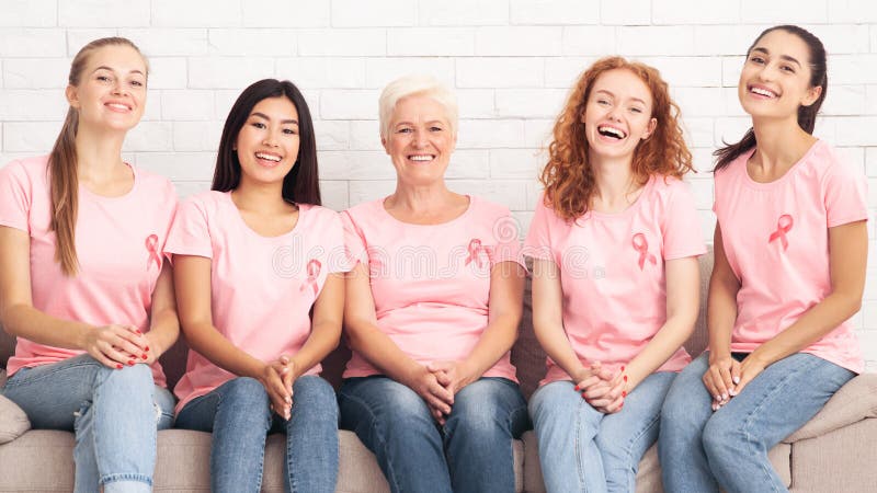 Ladies In Cancer T-Shirts Sitting During Support Group Meeting Indoor royalty free stock photography Ladies In Cancer T-Shirts Sitting During Support Group Meeting Indoor royalty free stock photography