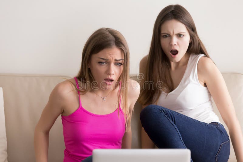 Ladies surprised with shocking movie plot twist stock image