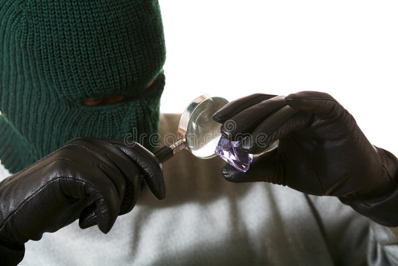 An image of a man in mask with lense and gem. An image of a man in mask with lense and gem