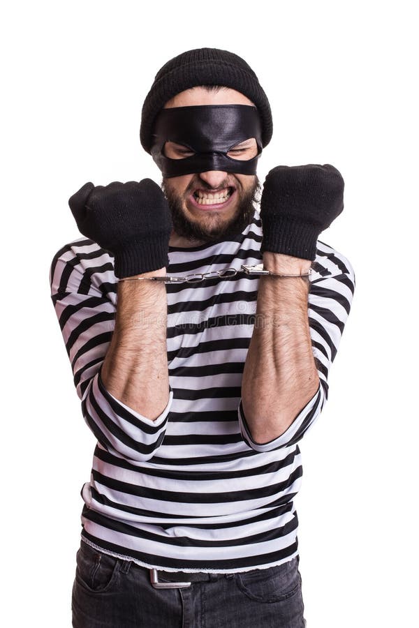 Angry robber with handcuffs. Portrait isolated on white background. Angry robber with handcuffs. Portrait isolated on white background