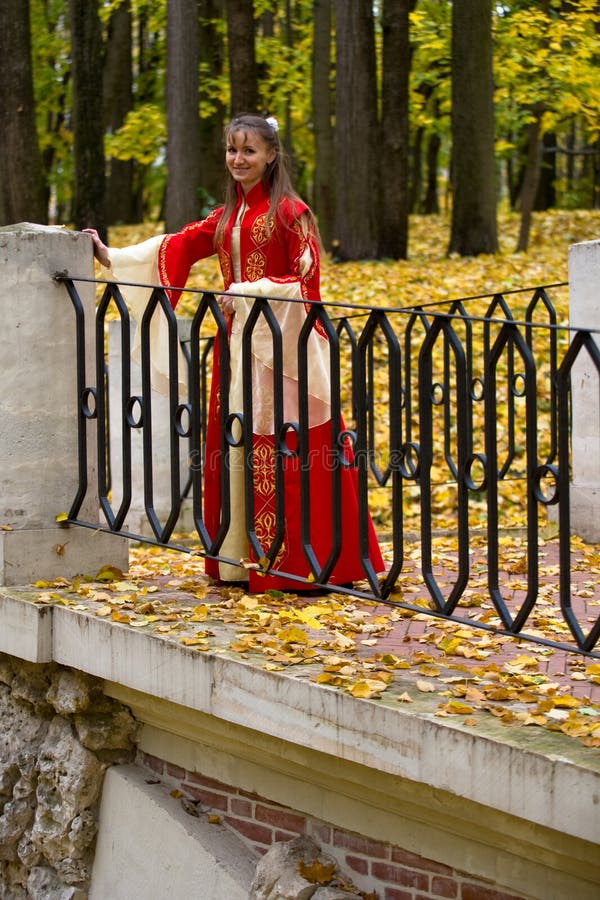 Lady in autumn forest