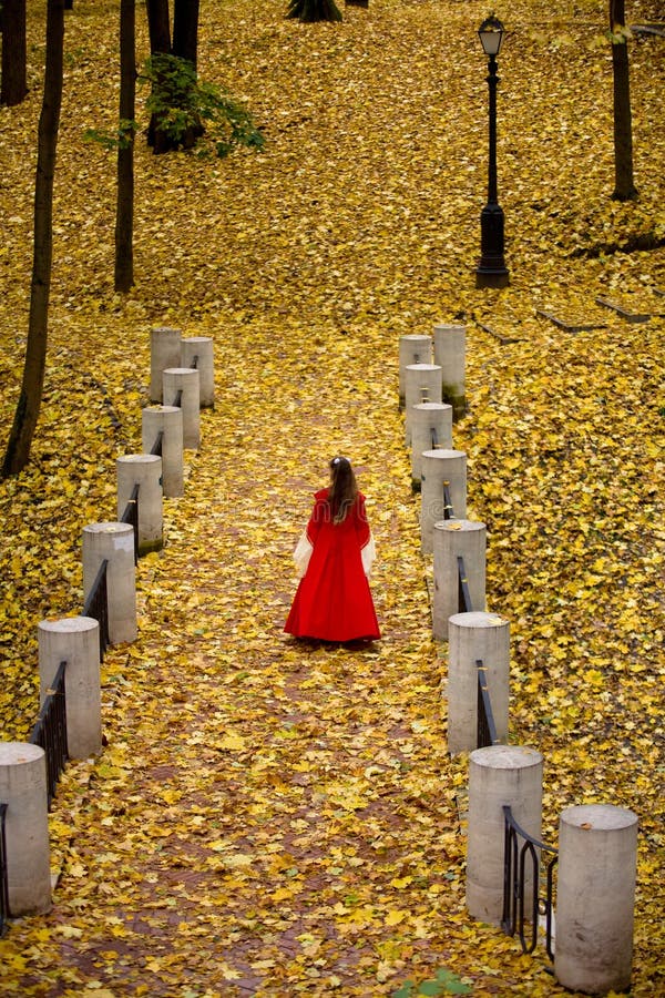 Lady in autumn forest