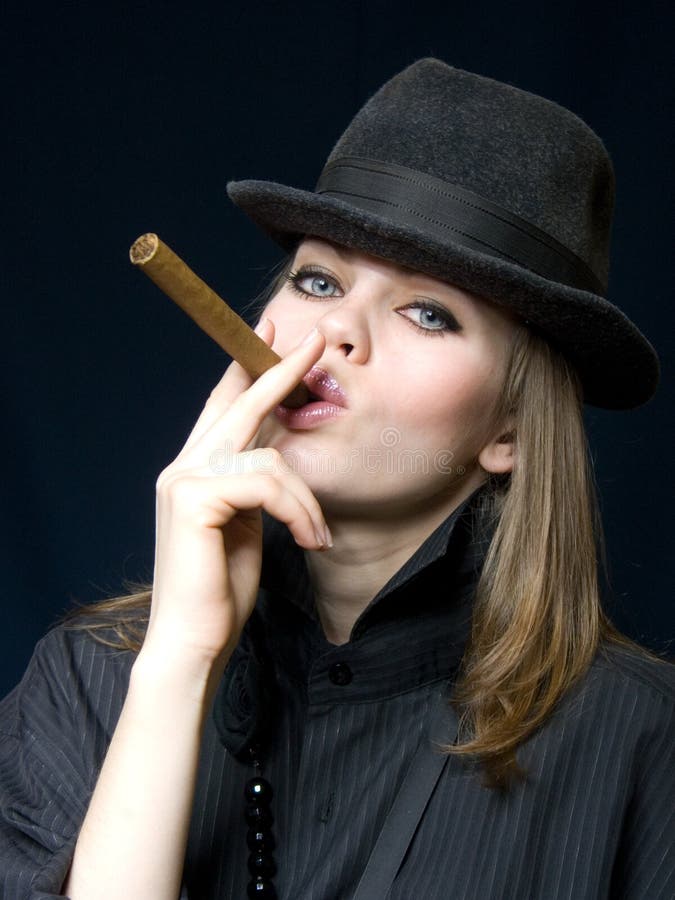Lady in black and a cigar stock photo. Image of dangerous - 12944486