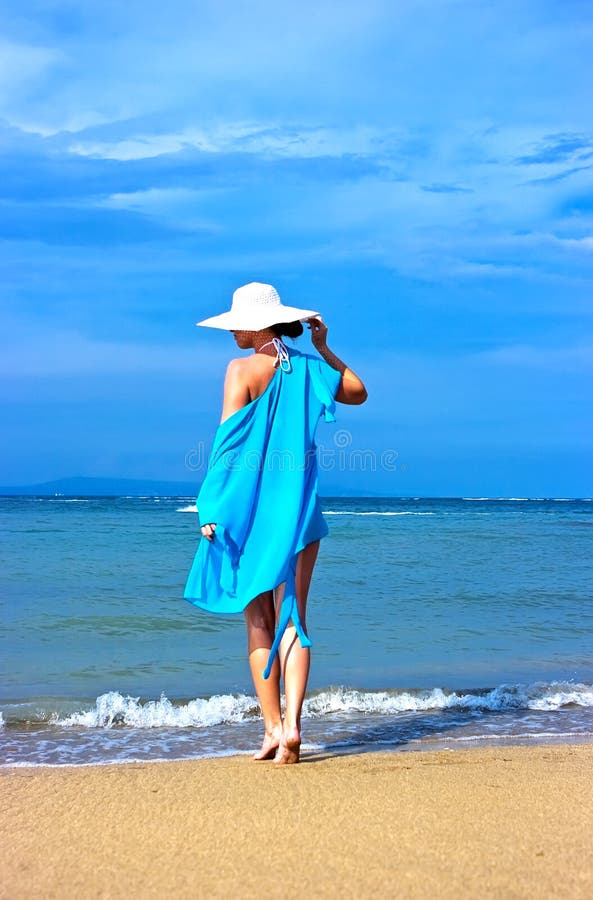 Lady in blue shawl on the beach