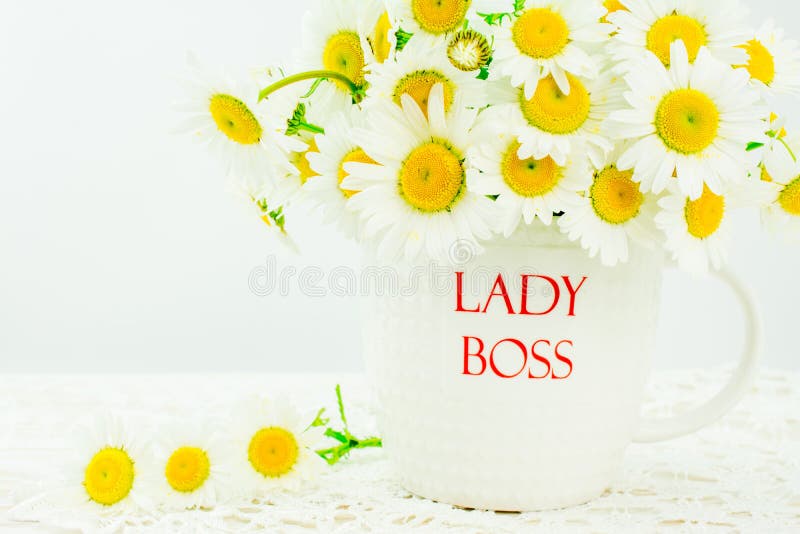 Lady boss mug with white  daisy flower on wooden background