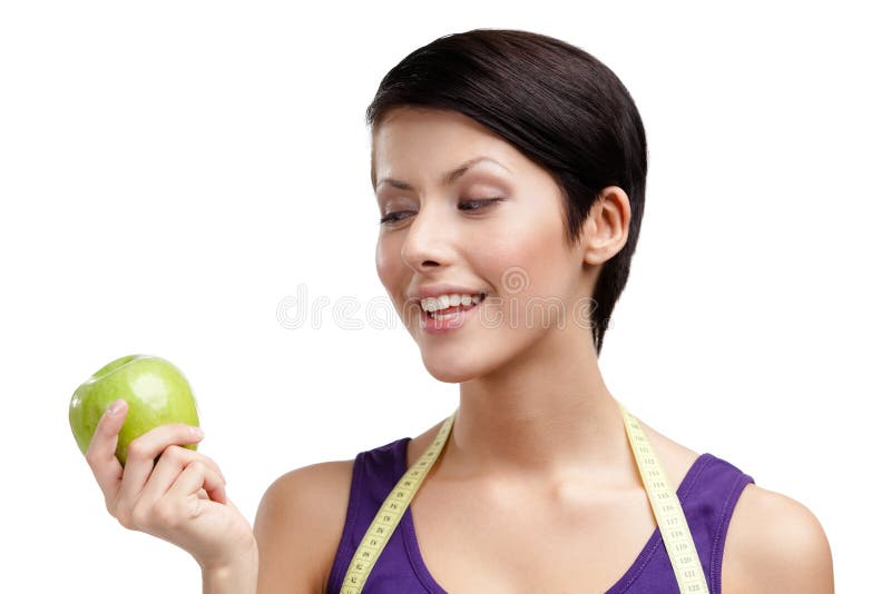 Lady with flexible ruler and green apple