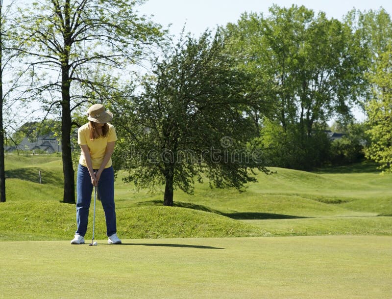 Lady On Golf Putting Green