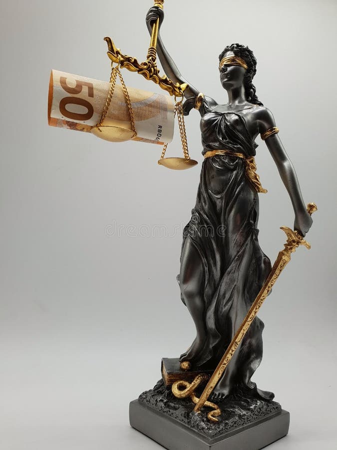 Lady Justizia with statute book and handcuffs